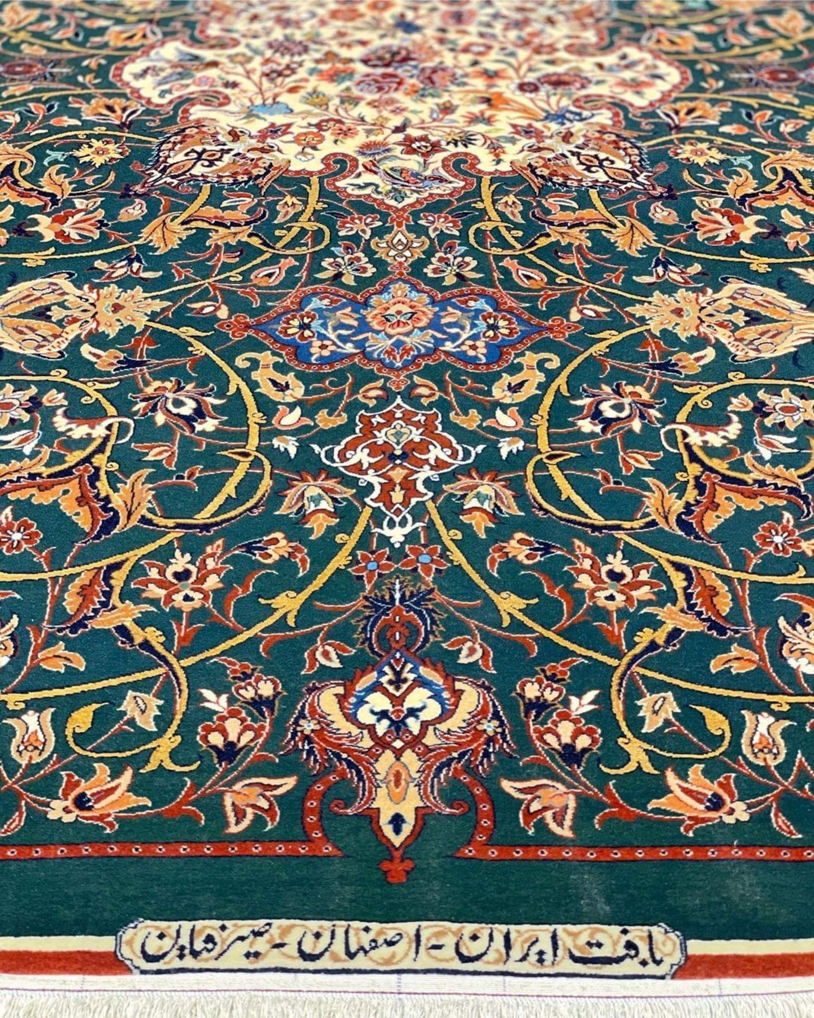 Hand-knotted Isfahan rug featuring gold, burgundy, and ivory floral patterns.